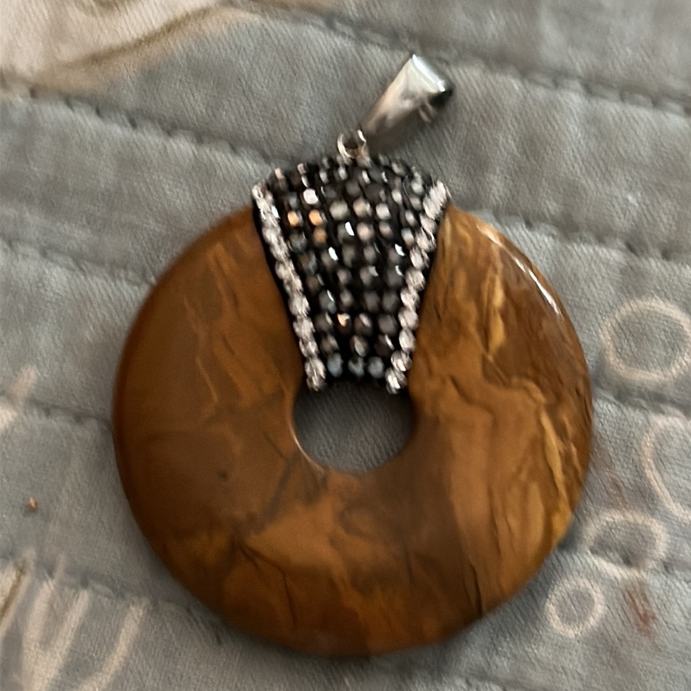 Large tiger eye ring encrusted with hematite and clear tiny crystals